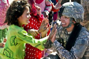 Female US soldier with children